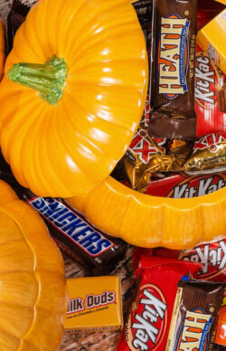 Decorative pumpkins filled with assorted Halloween chocolate can